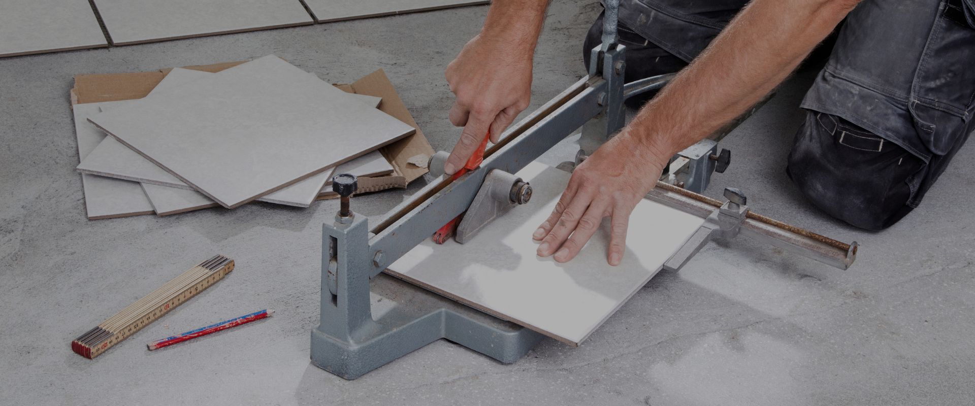 Handyman Frans installing floor tiles – reliable handyman services in Pretoria since 1990